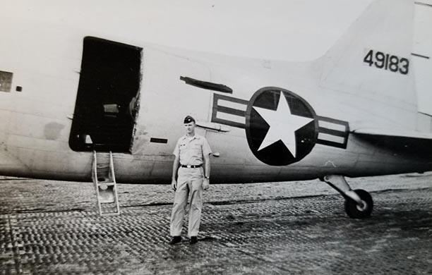 R. Craig Vulkoff ’56 stands in front on his aircraft