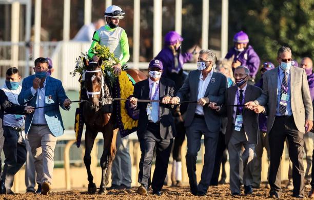 Mike Caruso walking with Monomy Girl at the Second Breeders Cup Championship