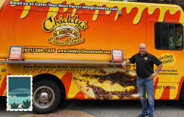 Mike Chidester stands proudly beside his brightly colored, orange and yellow food truck for Chiddy's Cheesesteaks