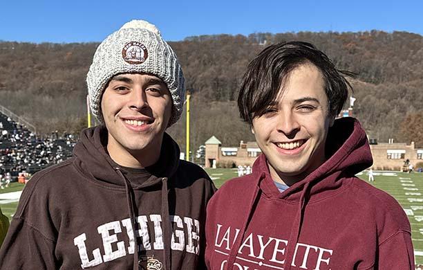 Chris wears a Lehigh beanie and sweatshirt while his twin Michael on the right wears a maroon Lafayette hoodie.