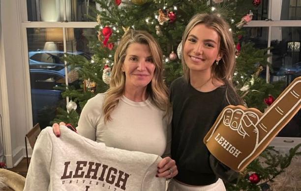 Catherine Hovey and daughter Mia smiling with Lehigh swag on Early Decision Day