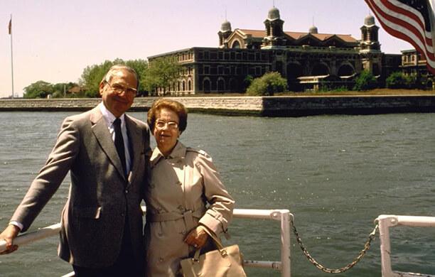 Lee Iacocca and his mother on a boat with Ellis Island in the background