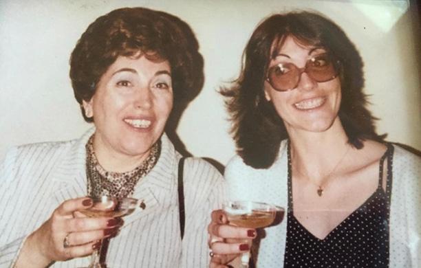 Patricia Stephenson and her mother Marie Smith hold up glasses to toast her graduation