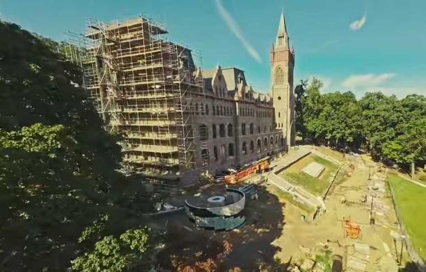 The front of the Clayton UC with scaffolding on the corner overseeing the construction of the fire pit.