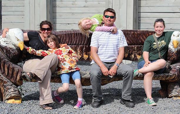 The five members of the Canadine family sitting on a bench