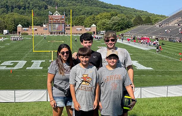 The five members of the Shmelzer family smiling in Goodman Stadium