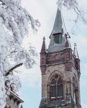 The tower of Packer Hall covered in snow.