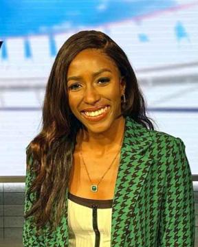 Renee Washington sitting on stage before a broadcast.