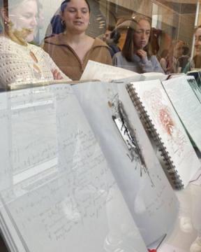 People looking at a book exhibit at the Berman Center