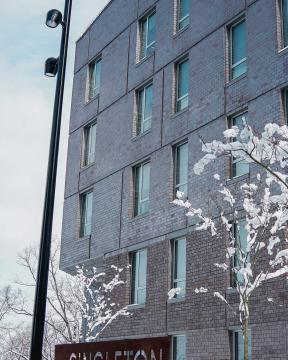 Singleton House signage surrounded by mounds of snow.