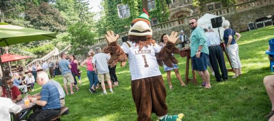 Clutch on the UC Lawn surrounded by alumni
