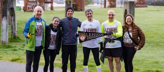 President Helble with alumni during the run in Seattle Washington