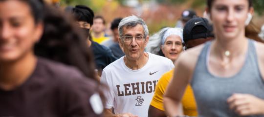 President Helble running in the Fun Run during Inauguration