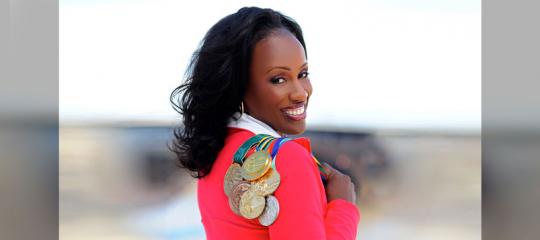 Jackie Joyner-Kersee posing with her medals