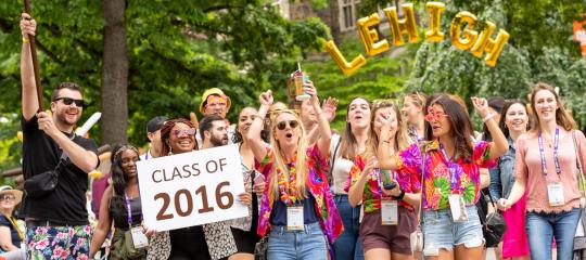 Lehigh alumni from the class of 2016 walk through Lehigh University's campus at a Reunion Weekend event.