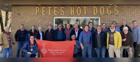 The Kappa Alpha Society poses outside Petes Hot Dog Shop