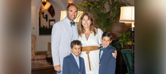 Hal and Erin Rechler and their two sons smiling