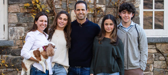Andrew and Kimberly Handler with their three children and two dogs