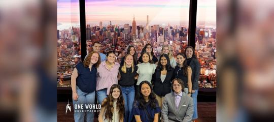 Many Soaring Together Scholars stand for a photo at the top of the World Trade Center Observatory