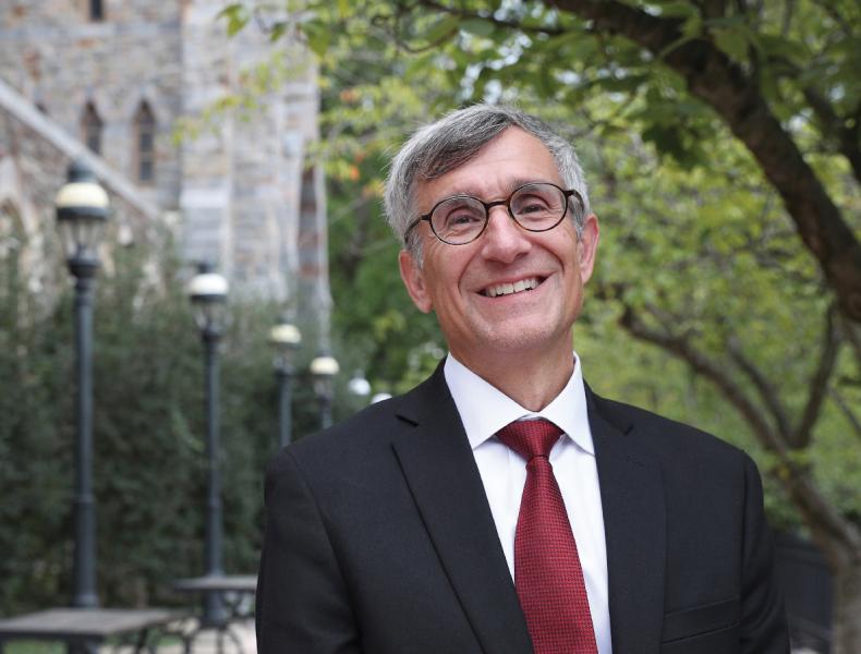 President Helble standing outside and smiling