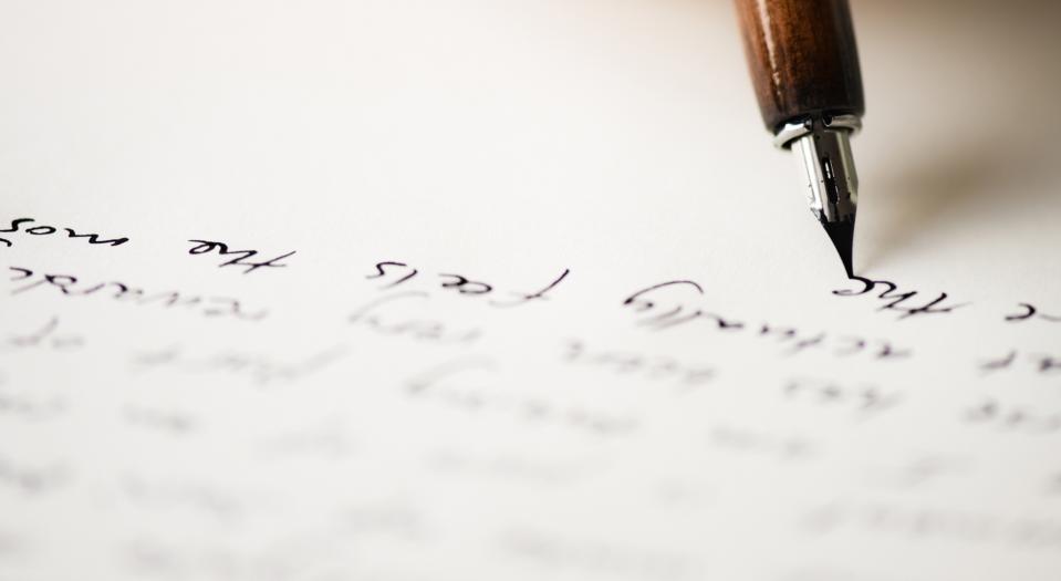 pen writing on paper