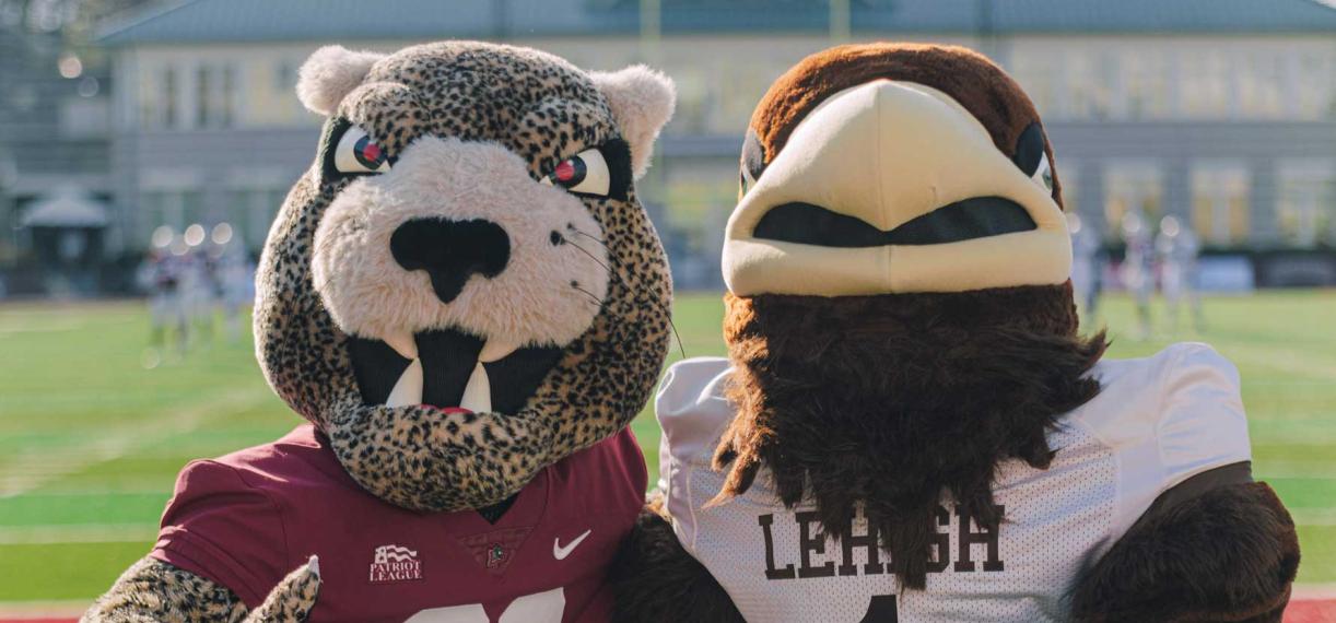 Clutch and the Leopard posed together on the football field
